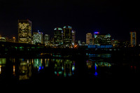 Take from the flood wall on the southside of Richmond Virginia the city colors reflect in the still of the James River