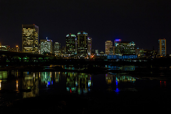 Take from the flood wall on the southside of Richmond Virginia the city colors reflect in the still of the James River